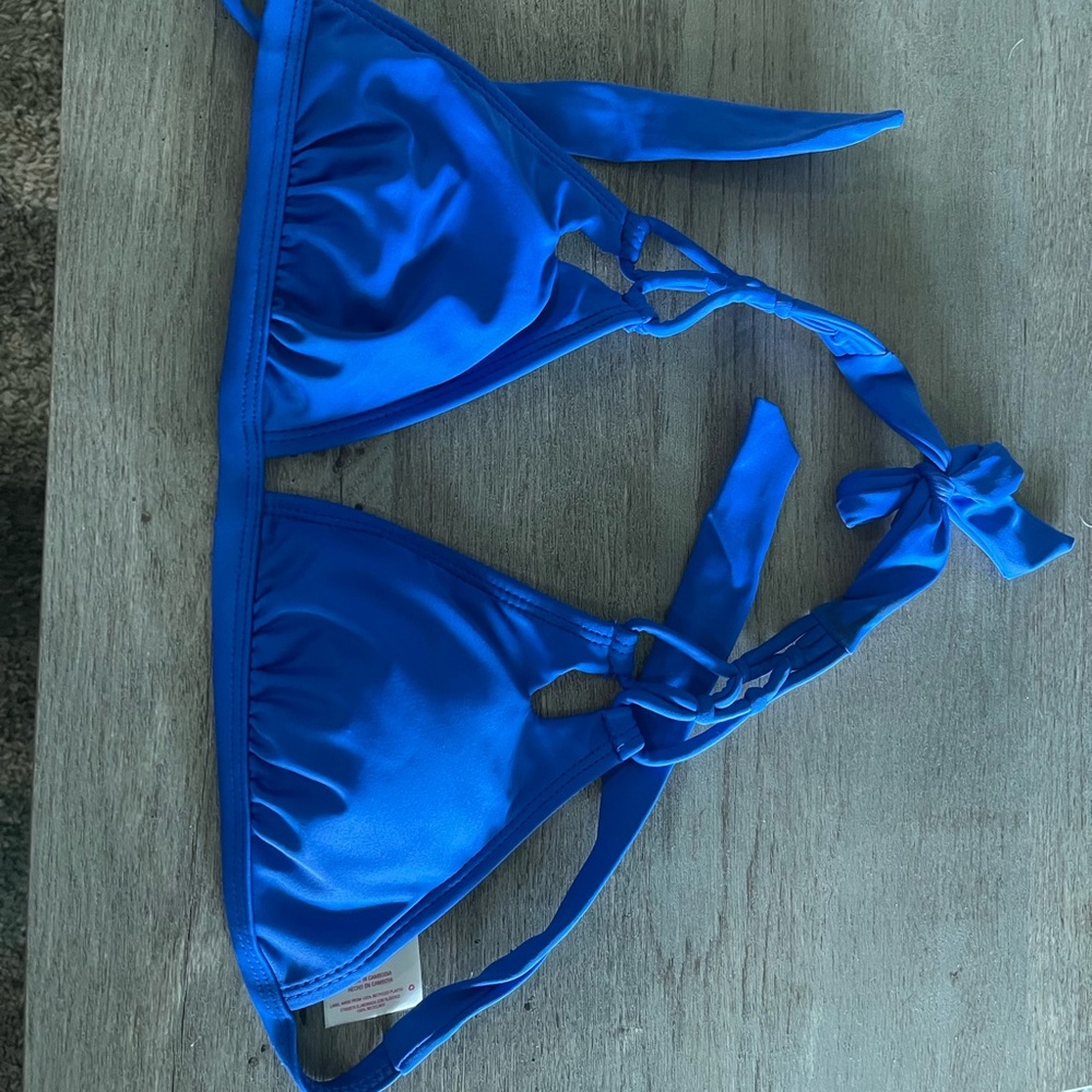 Blue bathing suit top with design cut outs